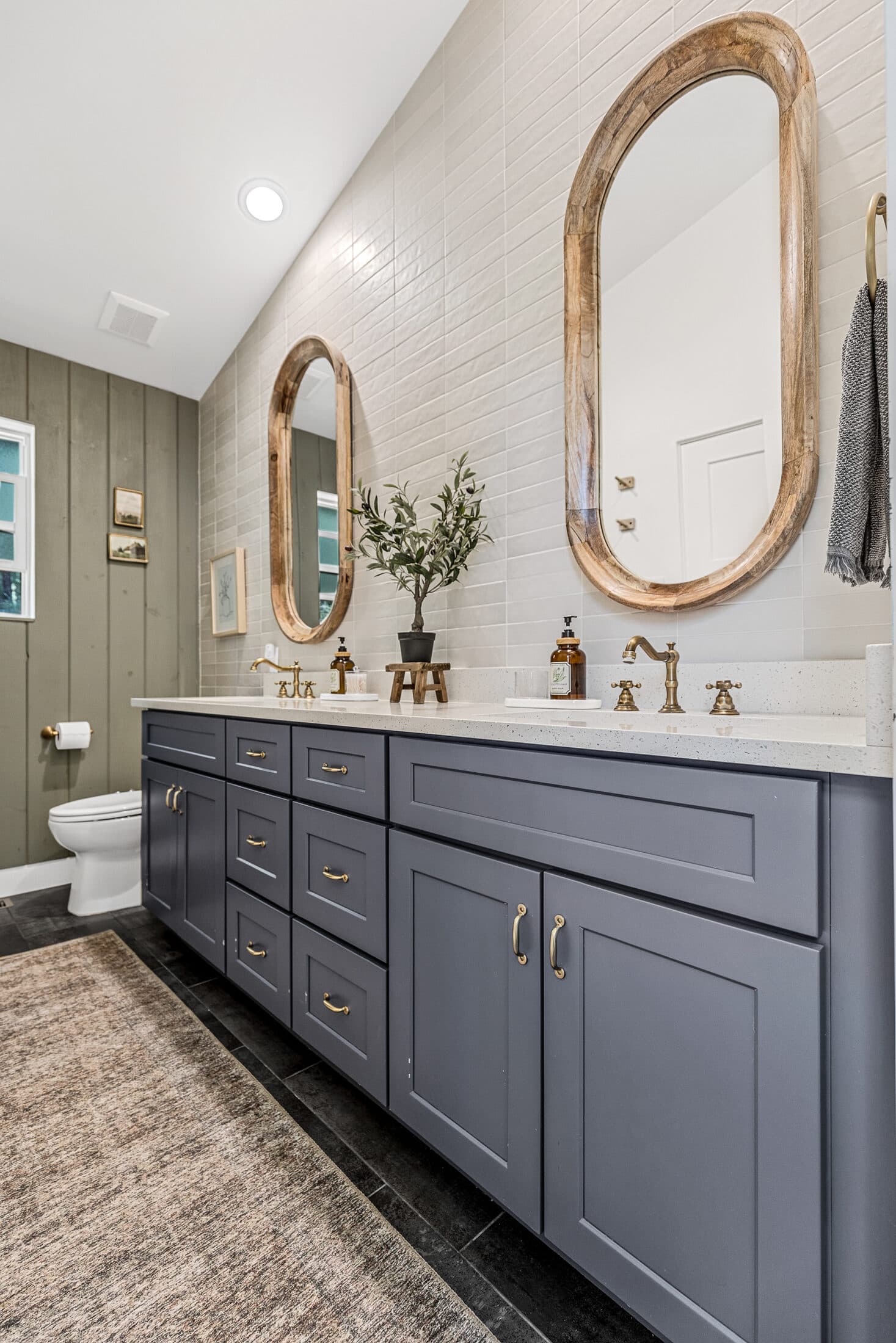 Double vanity bathroom with warm wood accents
