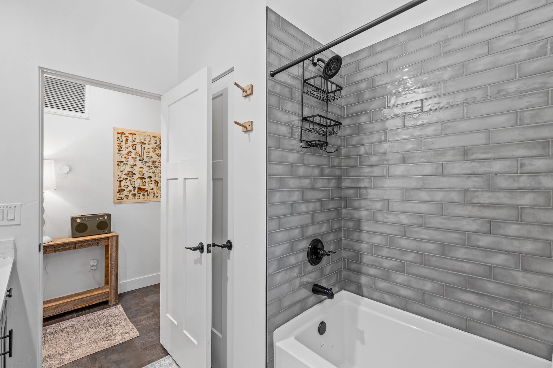 Tiled shower and tub with a ladder towel rack