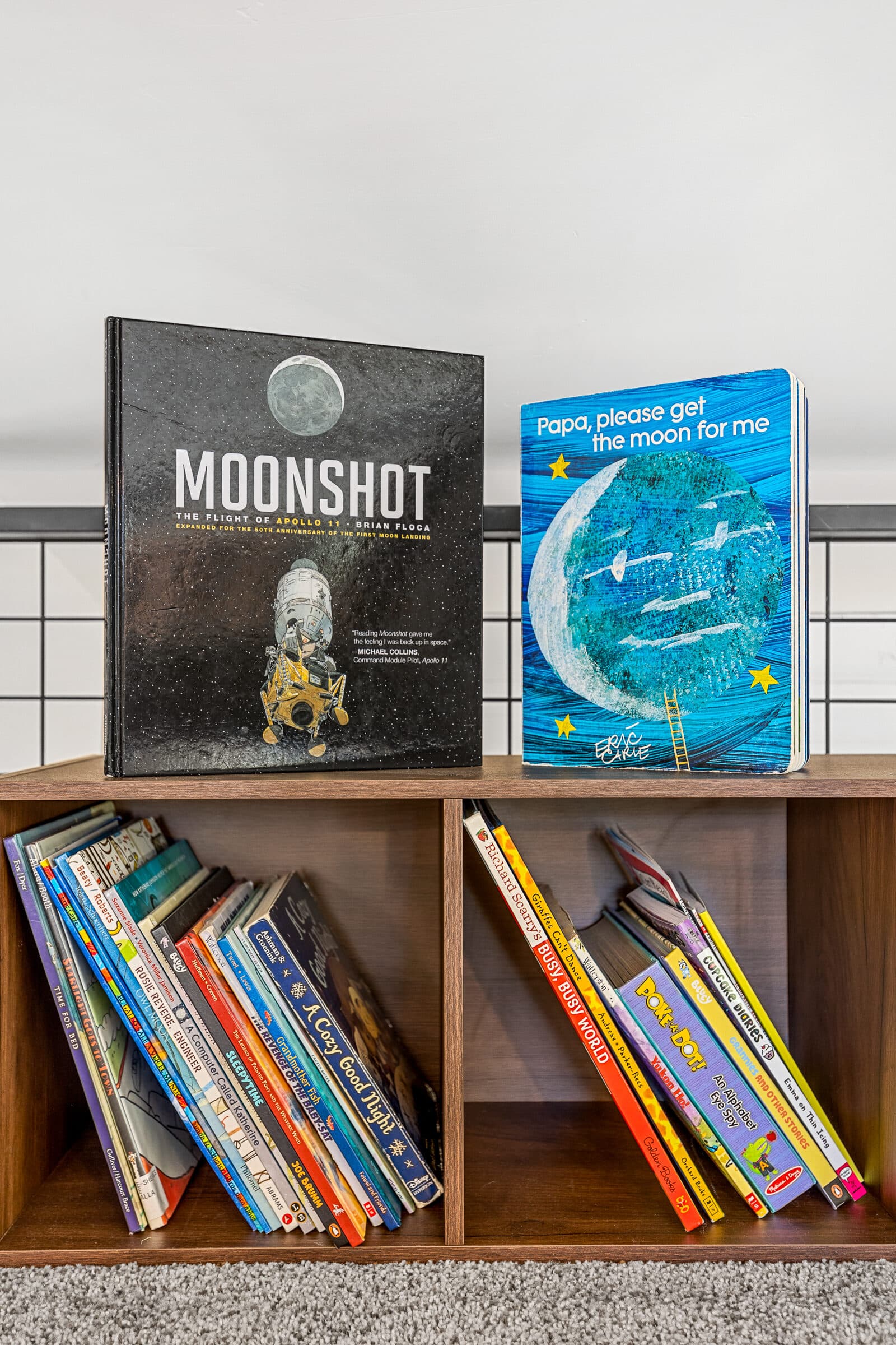 A shelf of books and board games for cozy nights in
