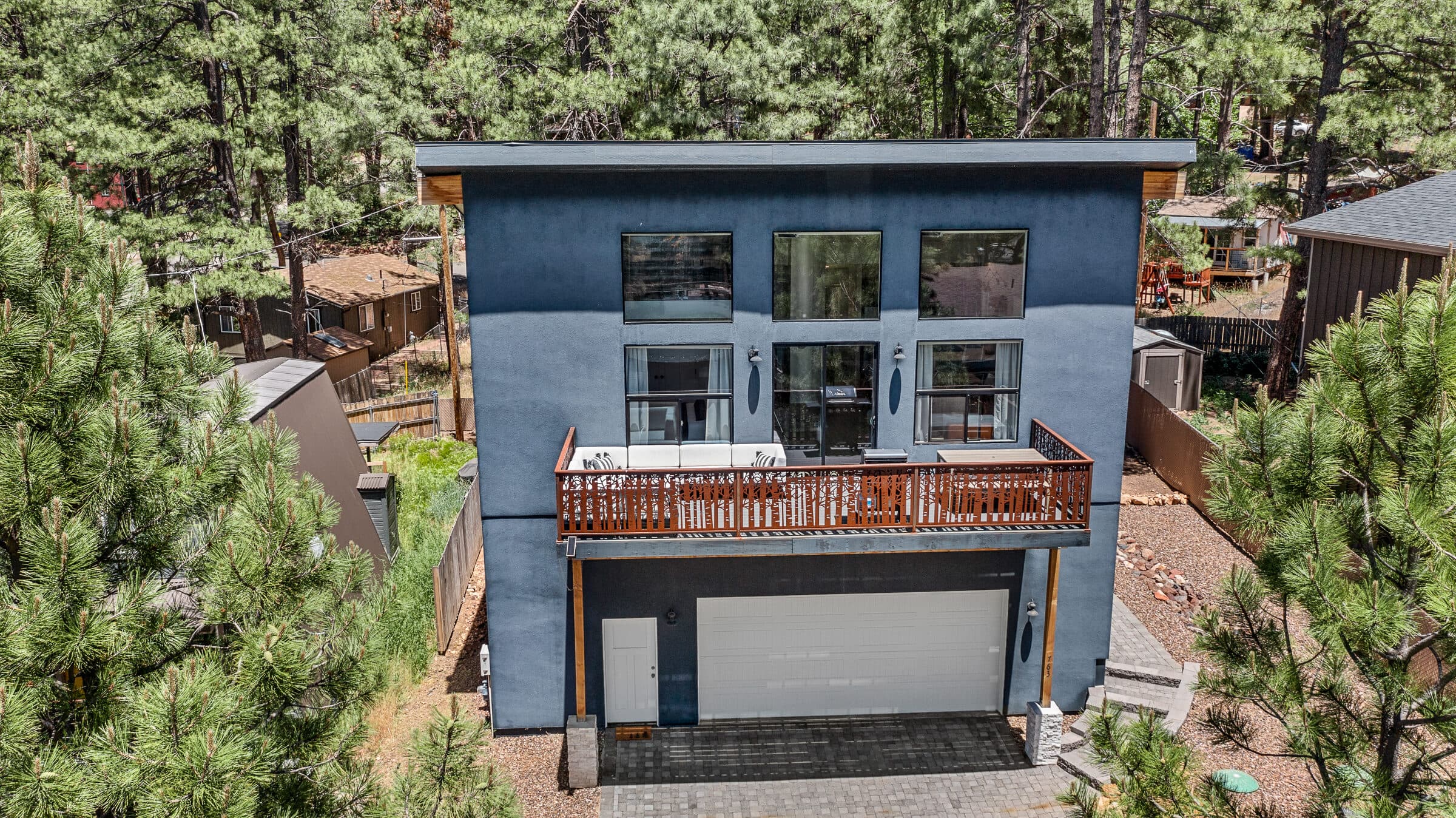 Front exterior of the two-story cabin with the garage below