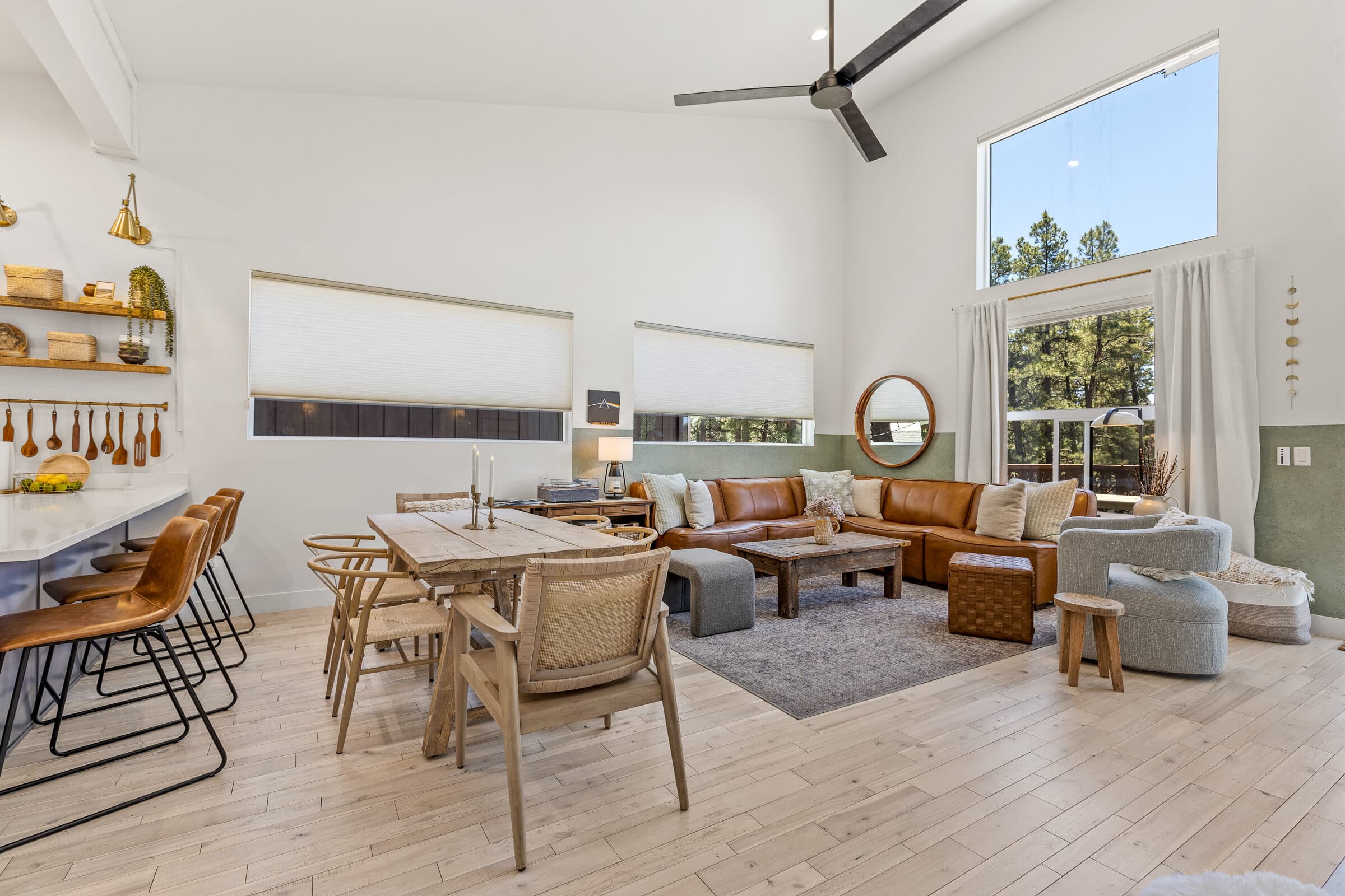 Living and dining area under the soaring vaulted ceiling