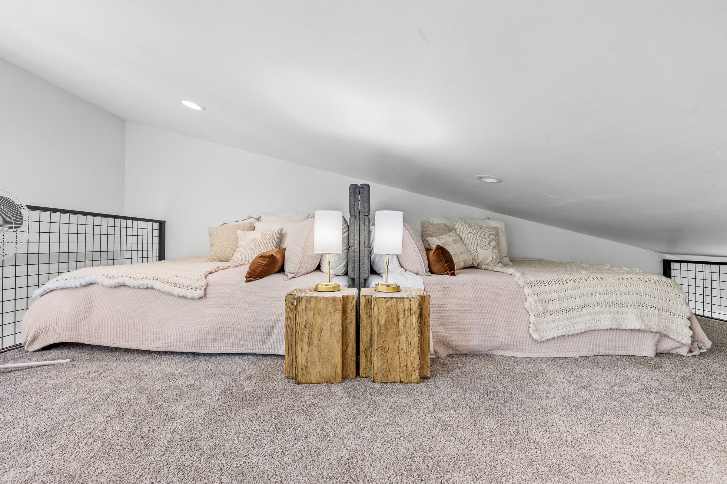 The guest-favorite loft with two queen beds under the eaves