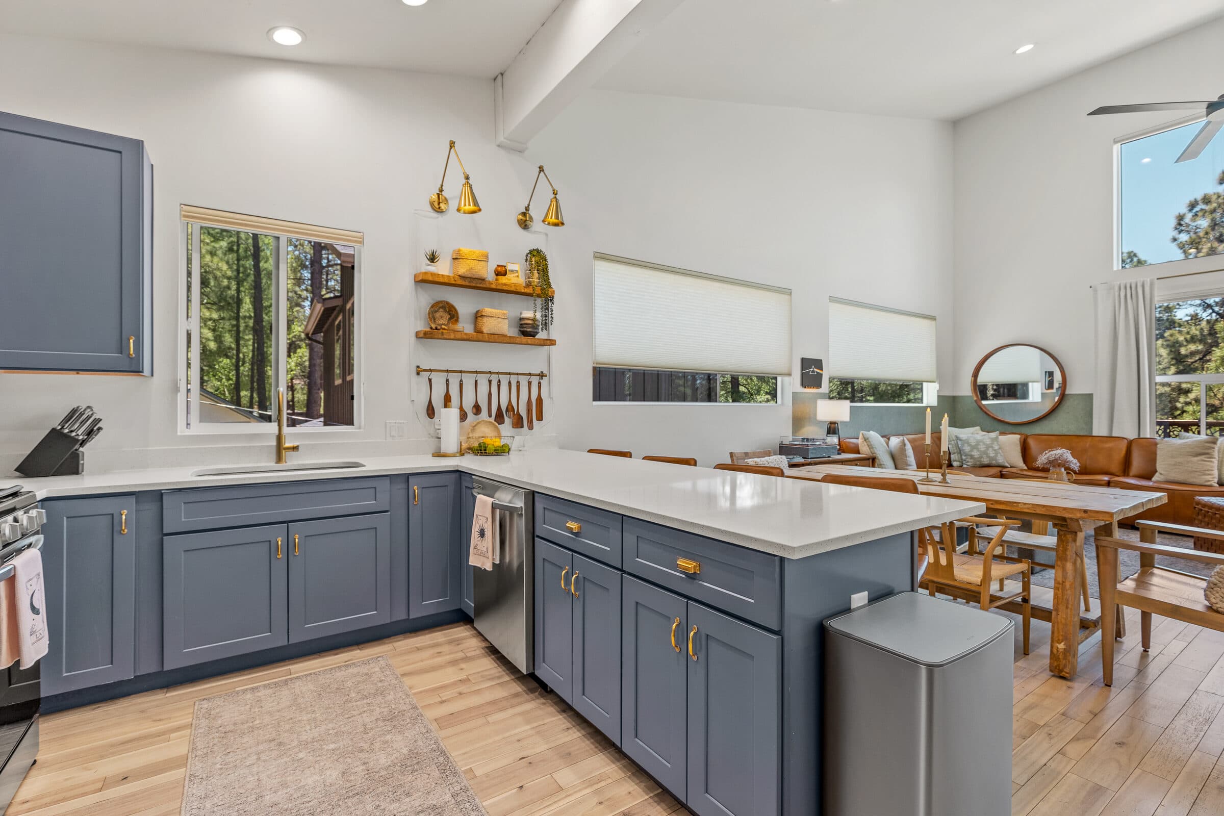 Chef's kitchen with gray cabinetry and a quartz island